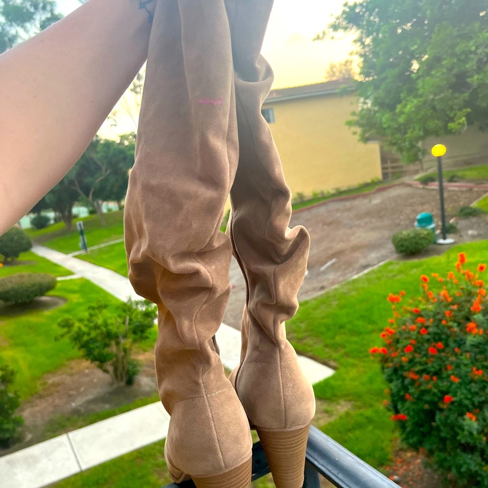 Beige knee high heeled boots
